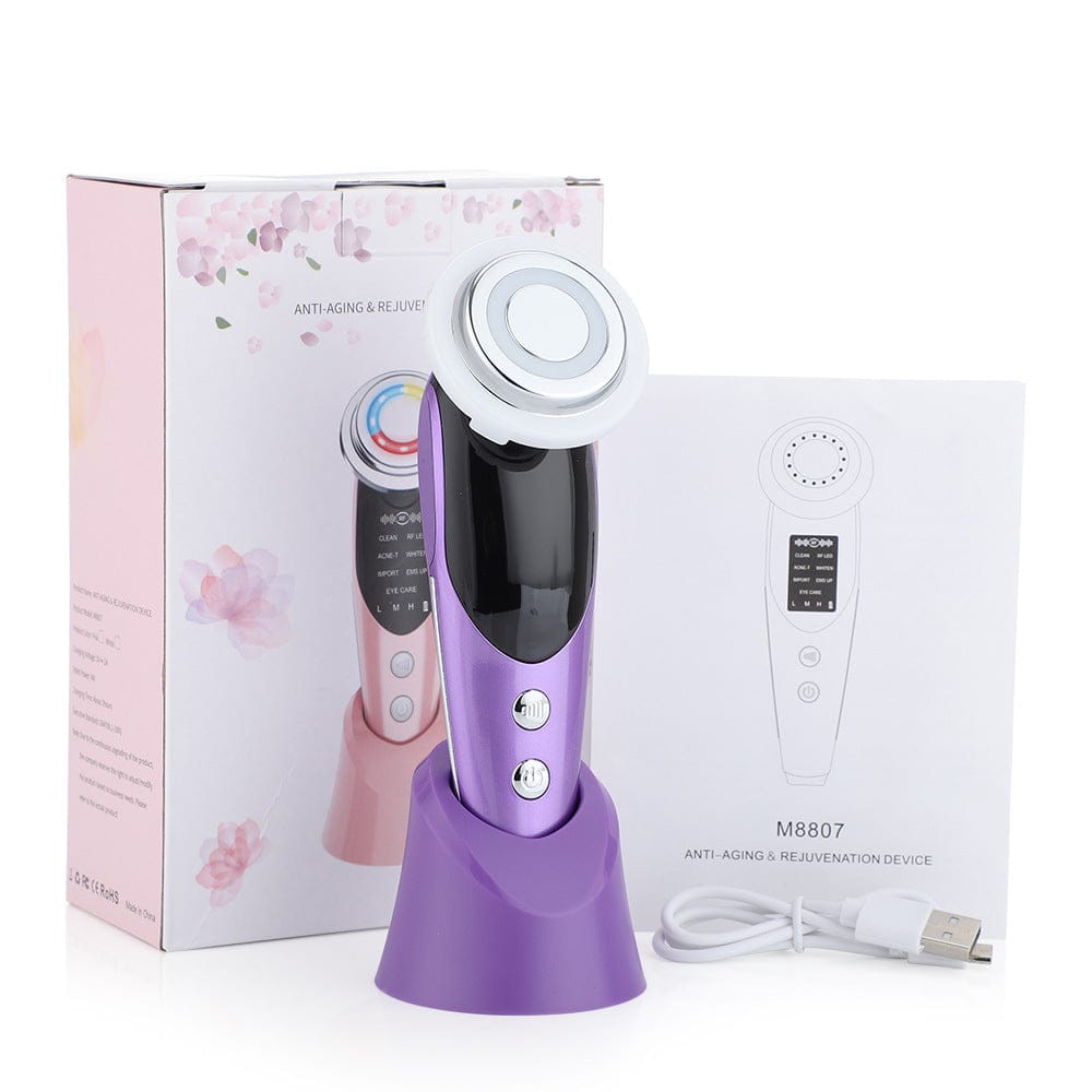 Image showcasing the complete Kskin multifunctional facial massager set, including the main device, interchangeable massage heads, and user manual. The arrangement highlights the sleek design and various components, emphasizing its versatility for achieving a rejuvenating facial massage experience at home.